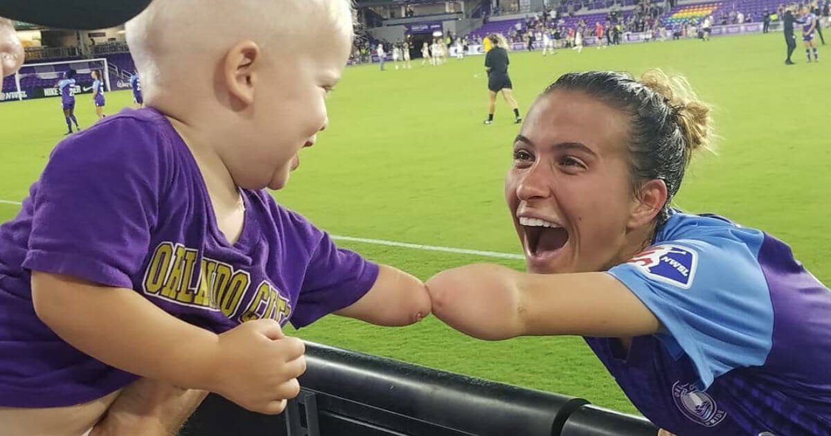 Viral photo captures precious bond between soccer star and one-year-old fan