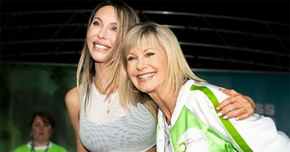 Olivia Newton-John joined by her family for cancer walk as the icon battles breast cancer for third time