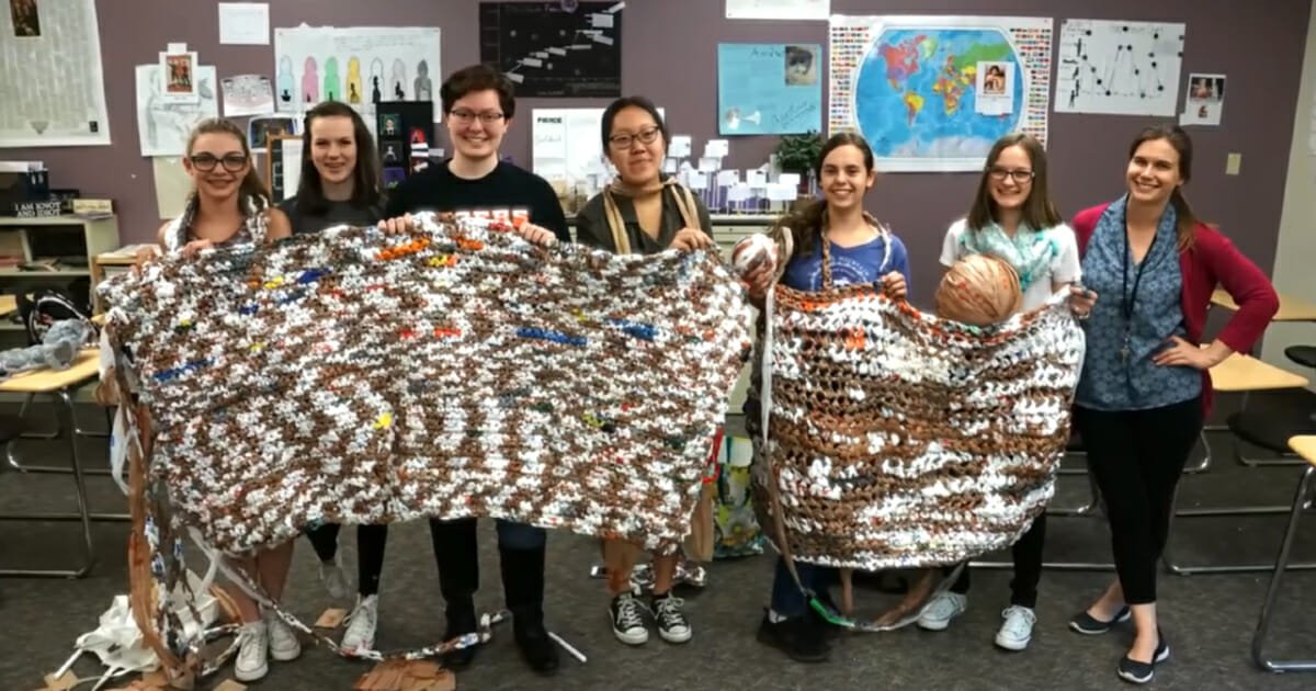 High school students transform plastic bags into 6-foot long sleeping mats for the homeless