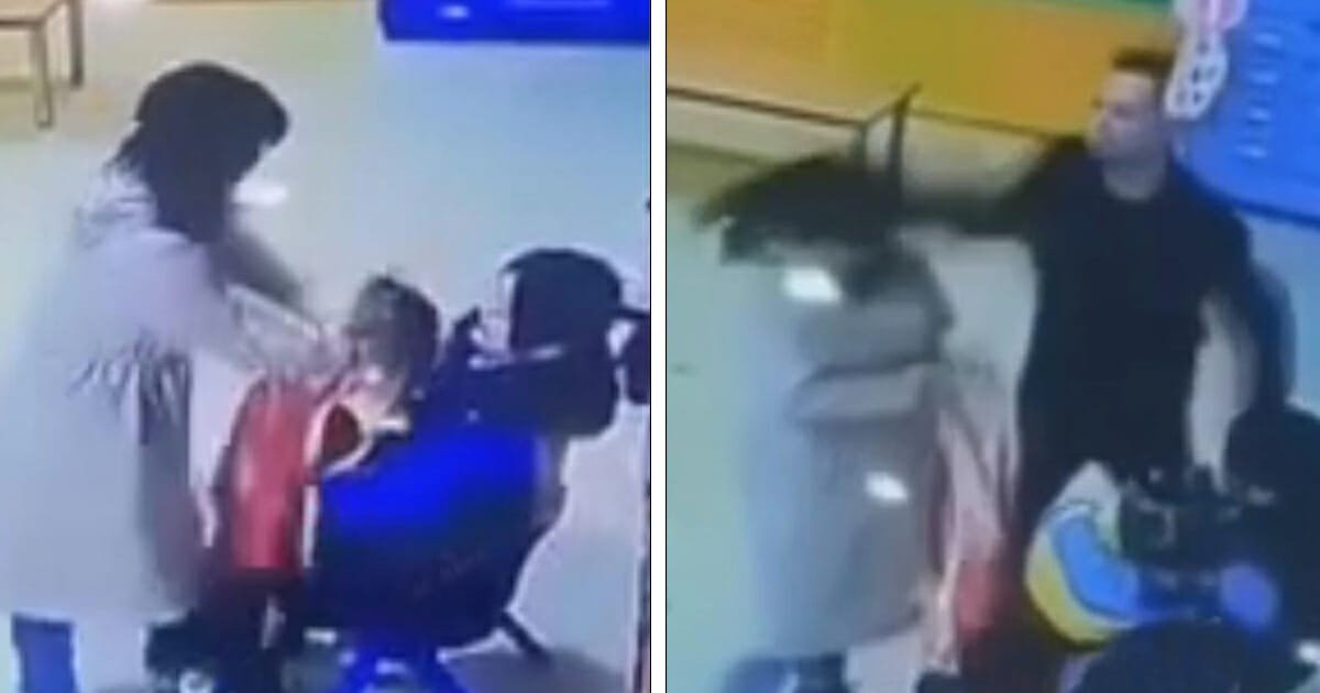 Kindergarten teacher smothers girl with apron, but doesn't know dad is watching camera outside