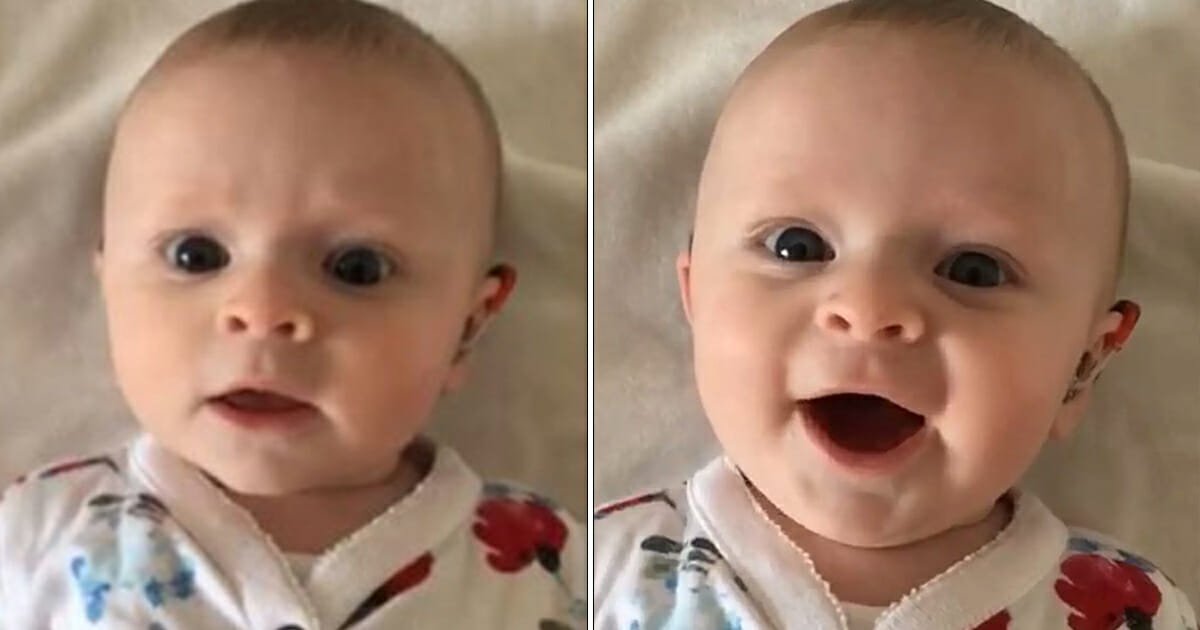 Baby born deaf smiles at parents when they turn on her hearing aids for the very first time