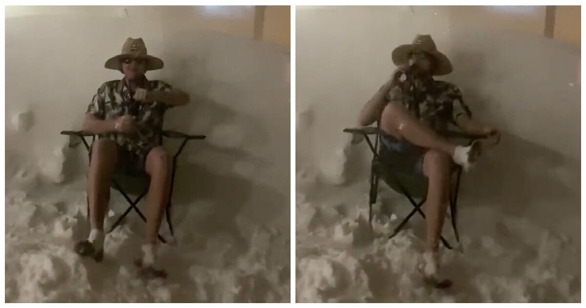 Chill Canadian guy cracks open a beer in the middle of massive blizzard